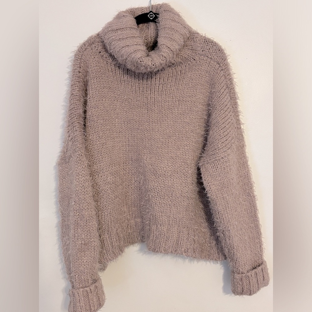 Lush bulky turtleneck sweater. Worn twice.  Light lilac color.